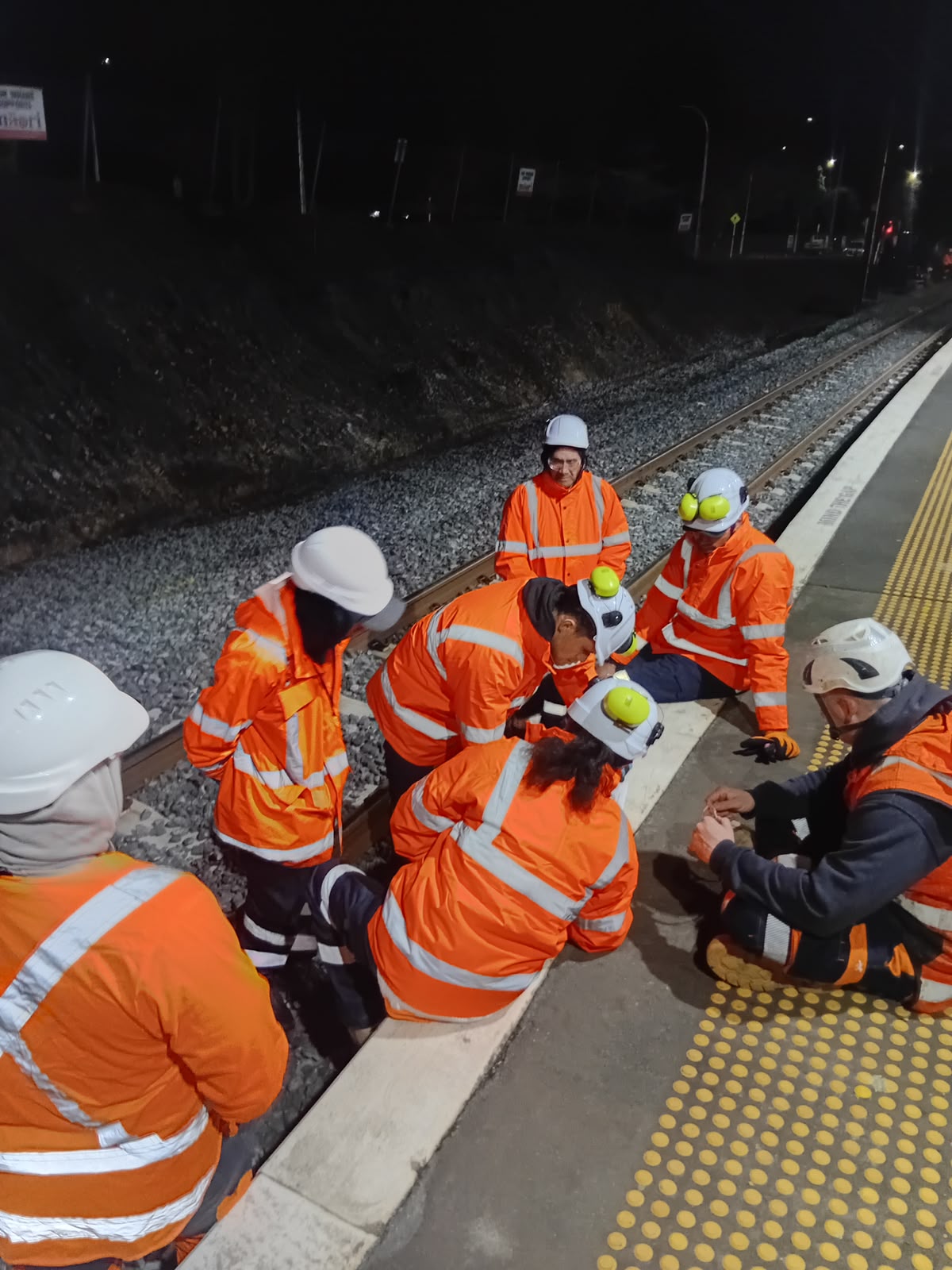 Provance rail crew working a night shift on the platform